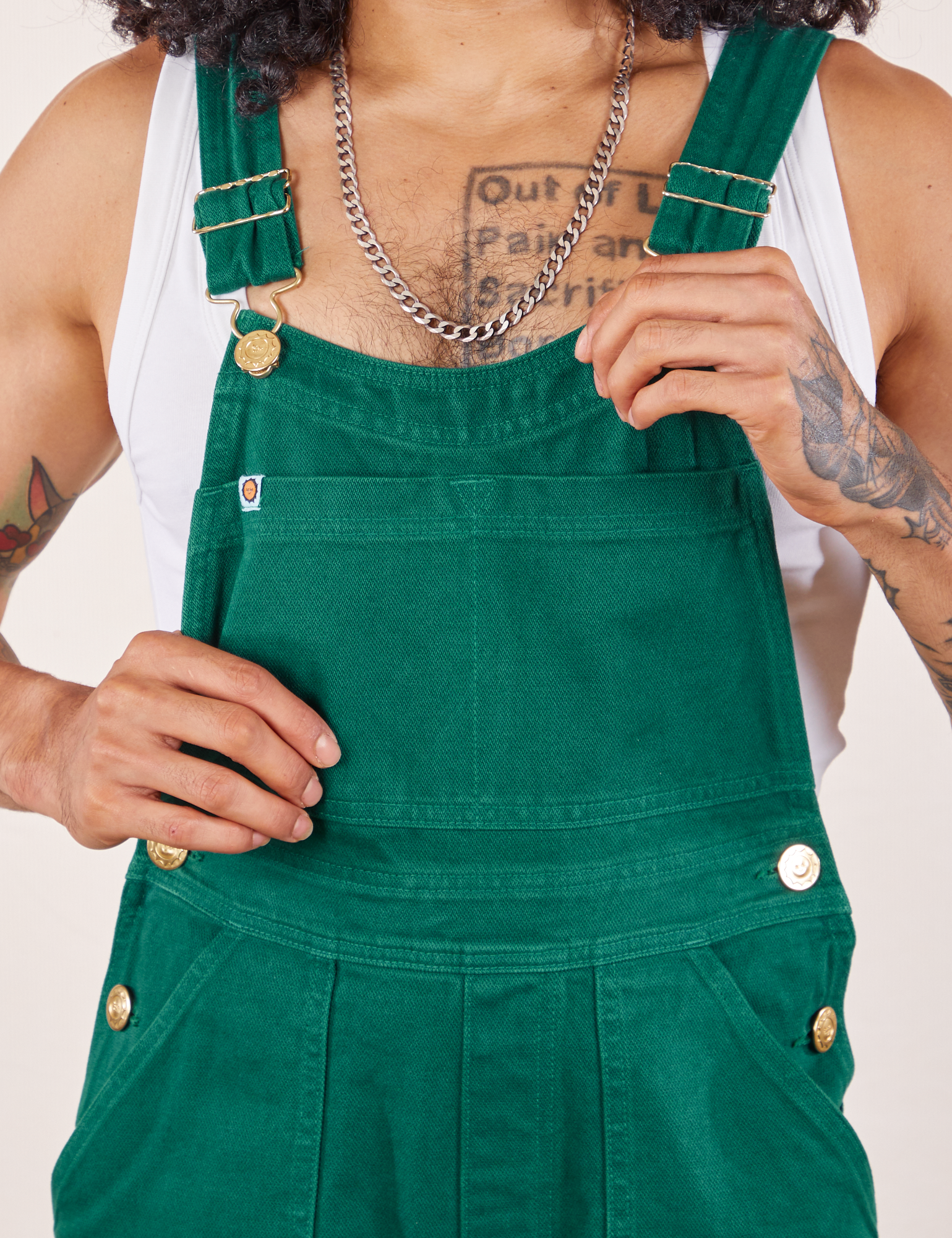 Front close up of Original Overalls in Mono Hunter Green worn by Jesse