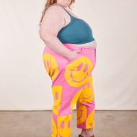 Side view of Icon Work Pants in Smilies and marine blue Cropped Cami worn by Catie