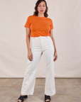 JV Tee in Construction Orange and vintage tee off-white Western Pants worn by Tiara