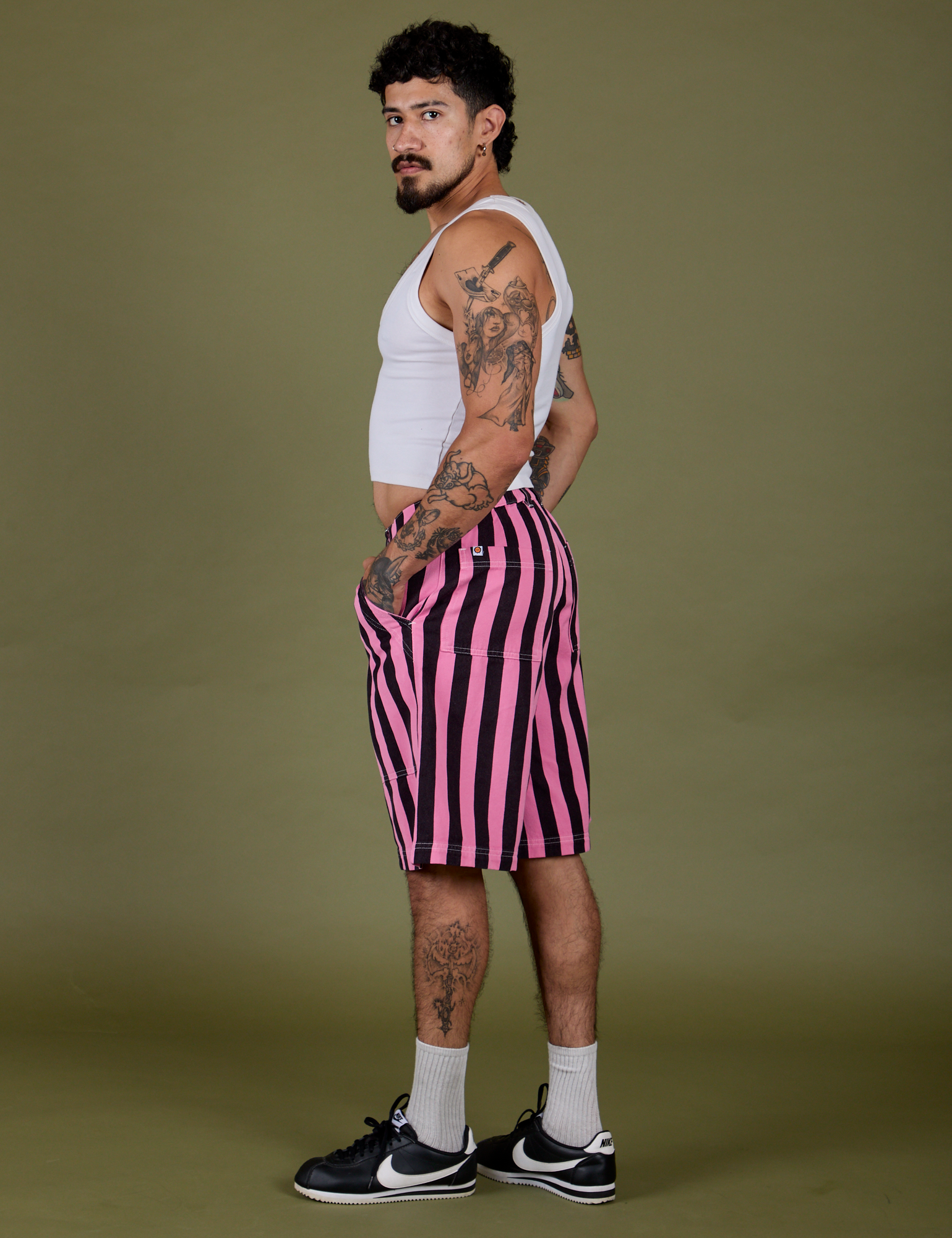 Side view of Longline Work Shorts in Bubblegum Pink and vintage tee white Cropped Tank