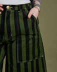 Close up of Sydney's hand in the front pocket of Longline Work Shorts in Evergreen