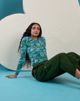 Shahana is wearing Long Sleeve Baby Tee in Angel Print and Drop Pocket Cargo Pants in Evergreen