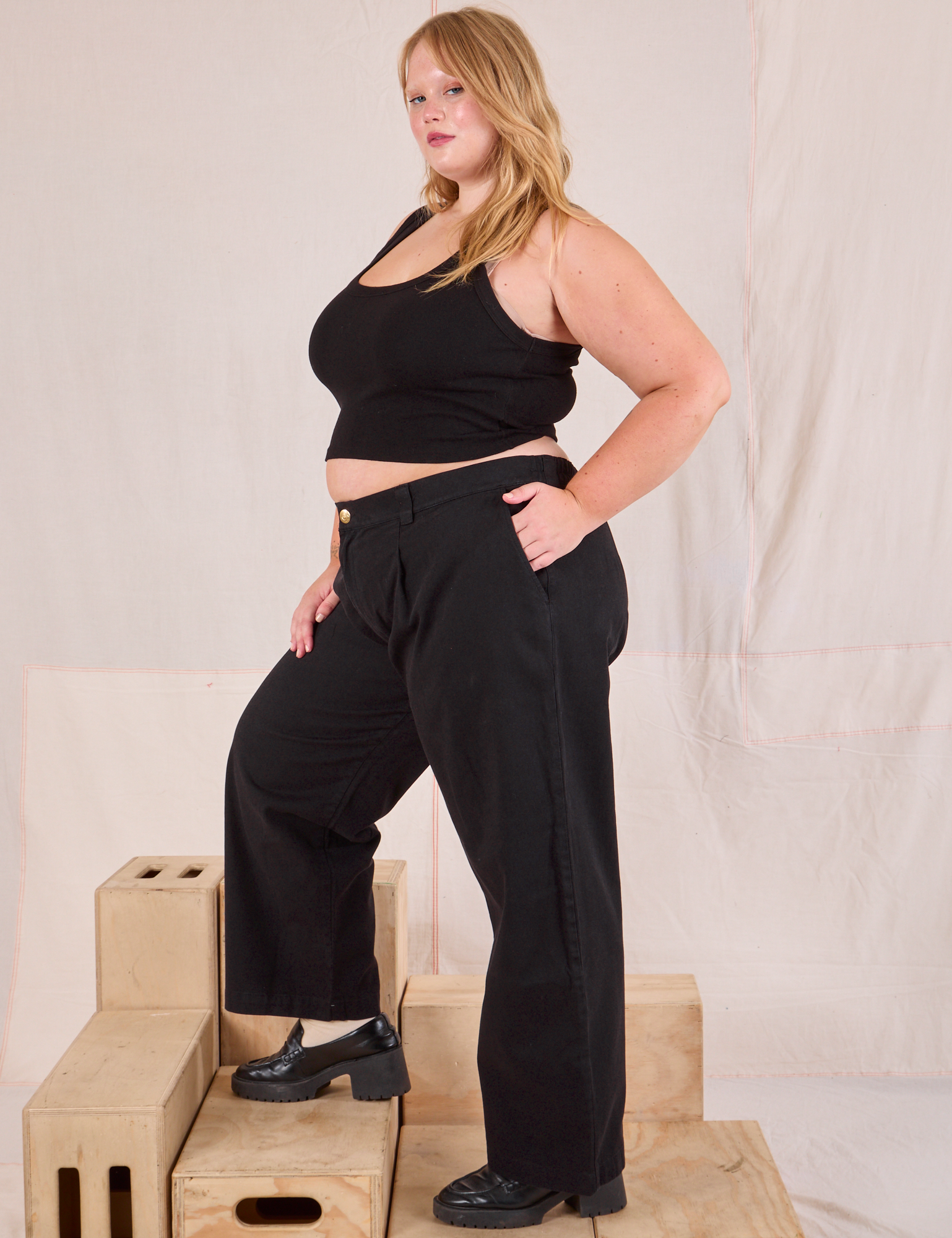 Side view of Mid-Rise Pleated Trousers in Basic Black and black Cropped Tank