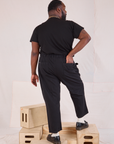 Back view of Mid-Rise Work Pants in Basic Black and black Organic Vintage Tee on Elijah