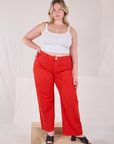 Lish is 5’8” and wearing XL Mid-Rise Work Pants in Mustang Red paired with a Cropped Cami in Vintage Tee Off-White