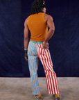 Back view of 4-Way Stripe Work Pants and spicy mustard Tank Top on Jerrod