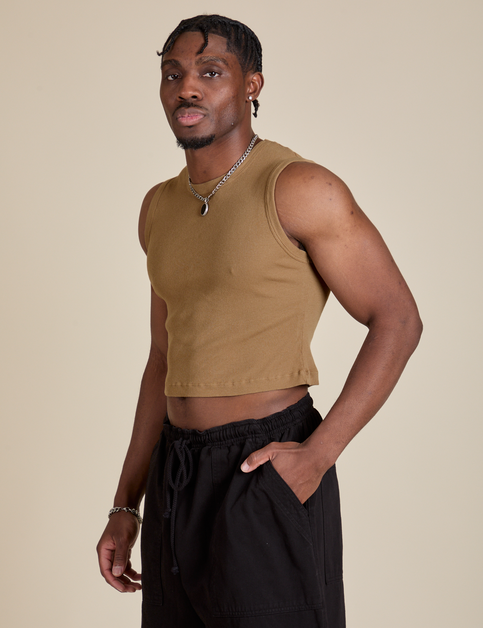 Angled front view of Muscle Tee in Desert Brown on Isaac