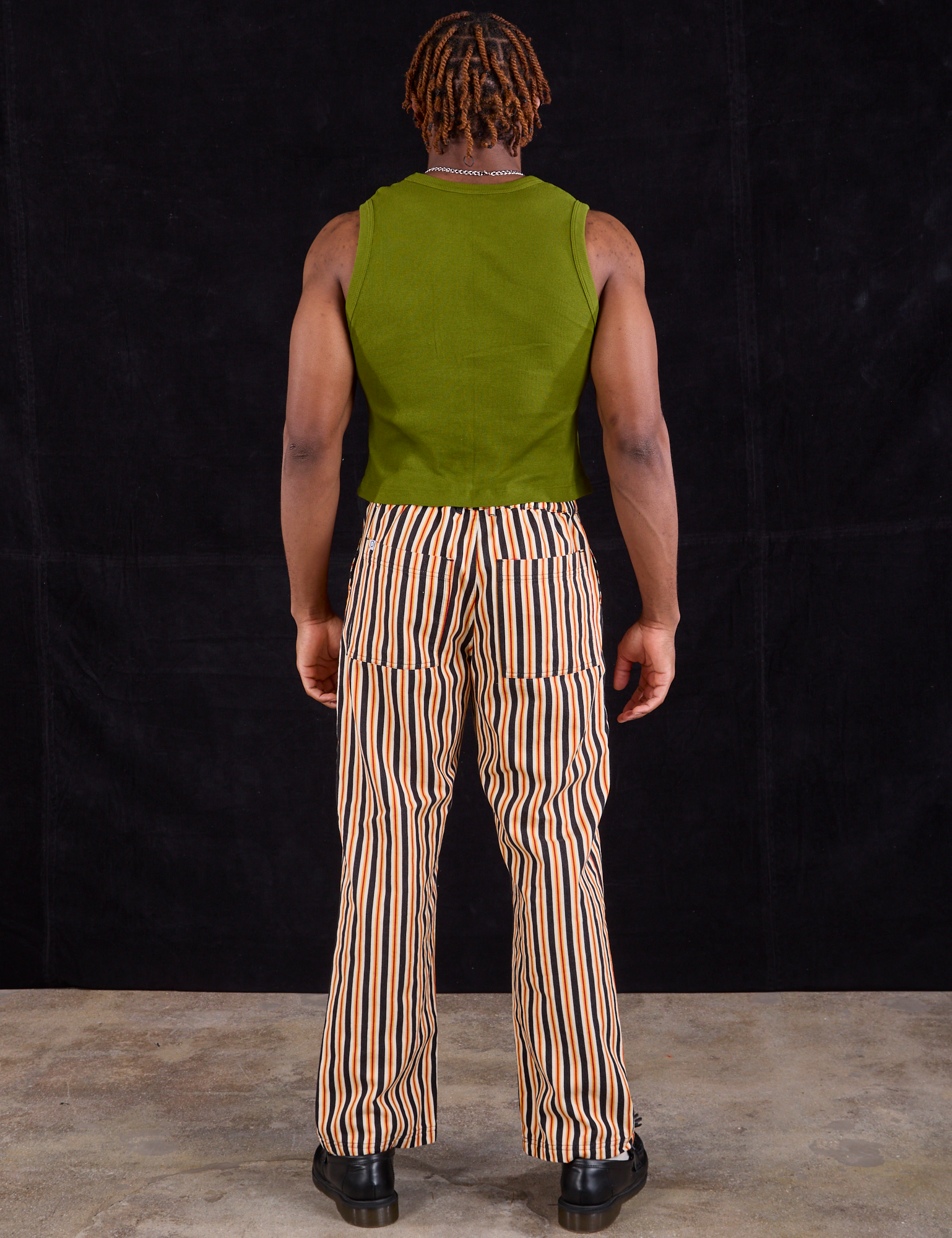 Back view of Work Pants in Autumn Stripe and summer olive Muscle Tee on Issac