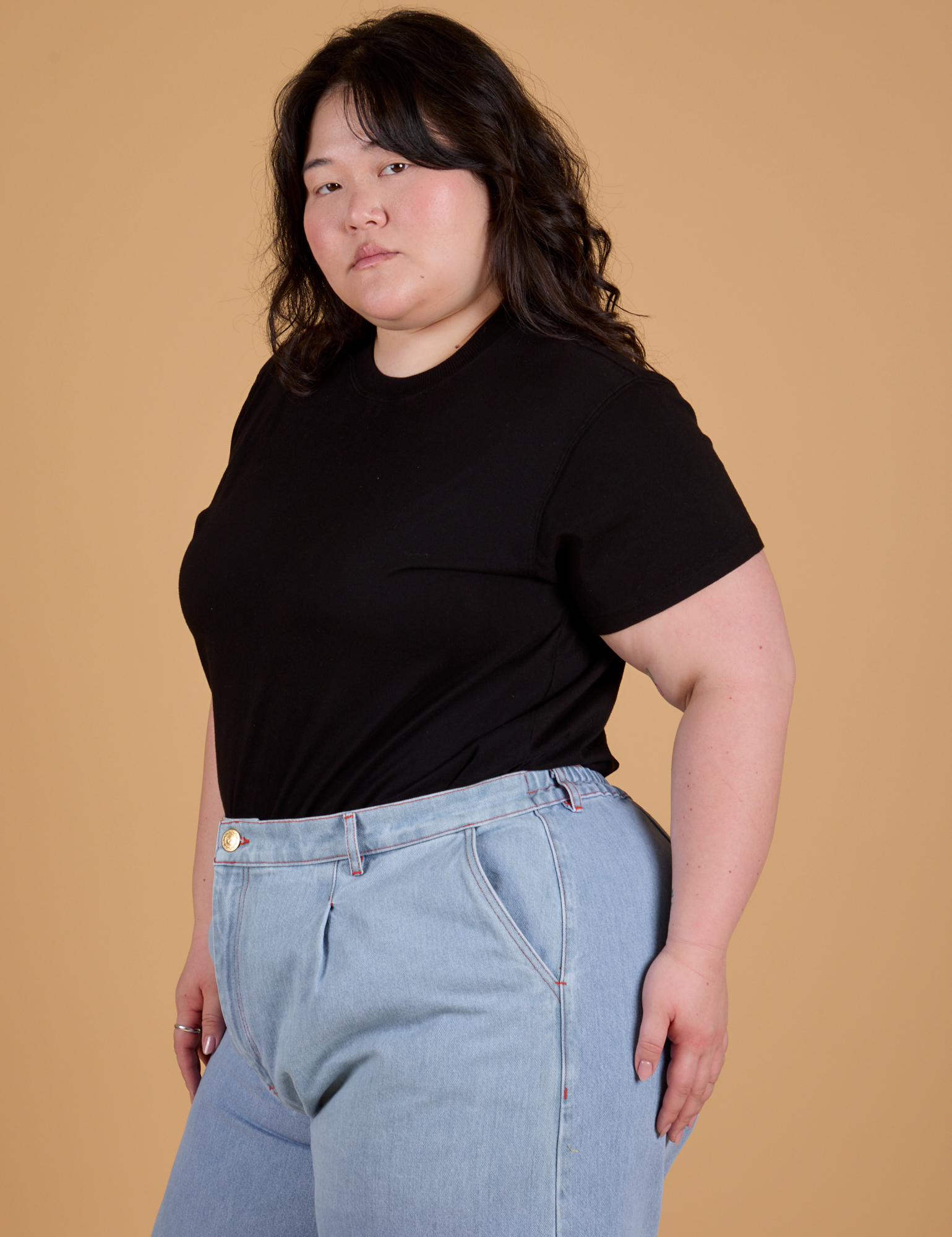 Angled front view of Organic Vintage Tee in Basic Black on Ashley