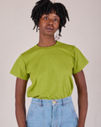 Cheyann is wearing Organic Vintage Tee in Gross Green tucked into light wash Carpenter Jeans