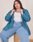 Marielena is wearing Oversize Overshirt in Marine Blue with a vintage off-white Cropped Tank Top underneath