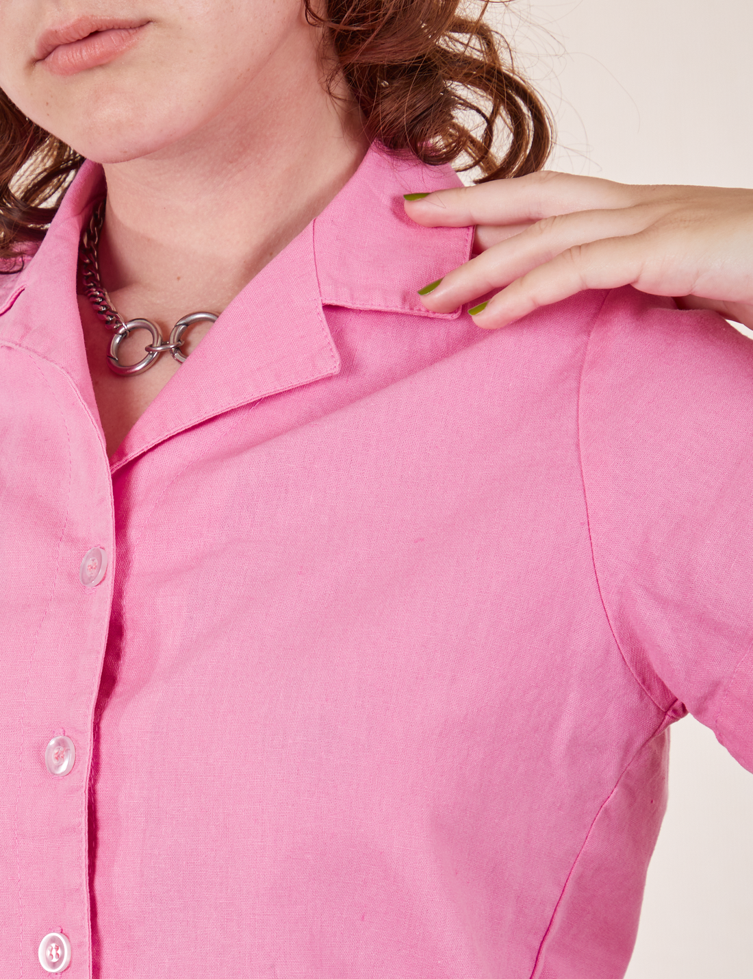 Front close up of Pantry Button-Up in Bubblegum Pink worn by Alex