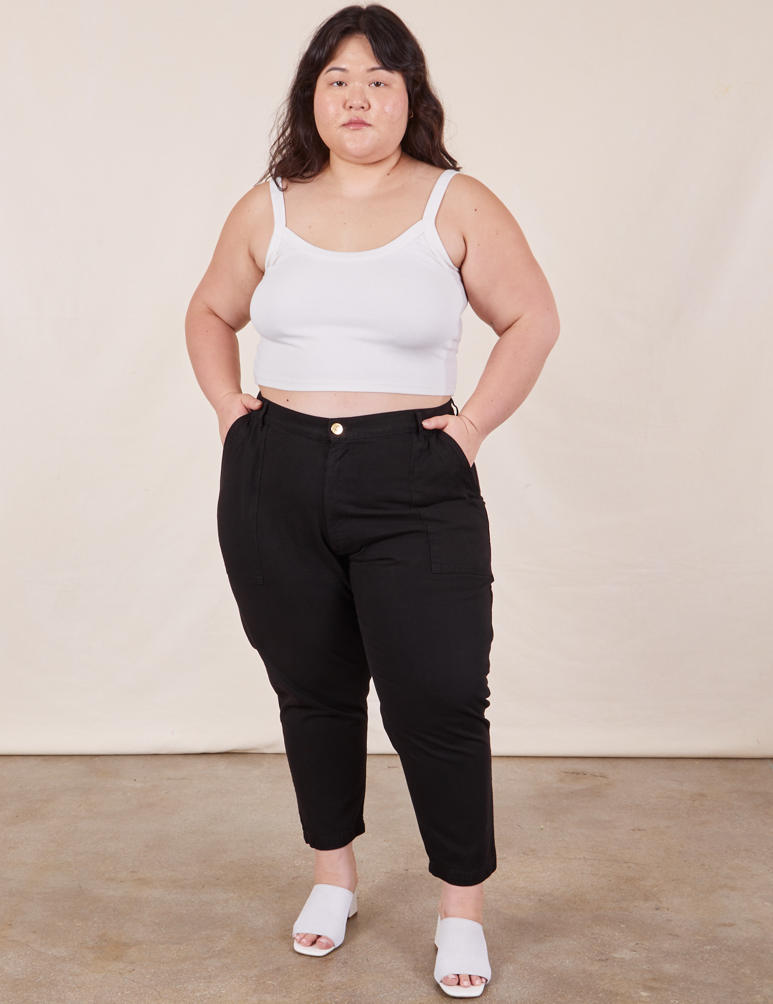 Ashley is 5&#39;7&quot; and wearing 1XL Petite Pencil Pants in Basic Black paired with vintage off-white Cropped Cami