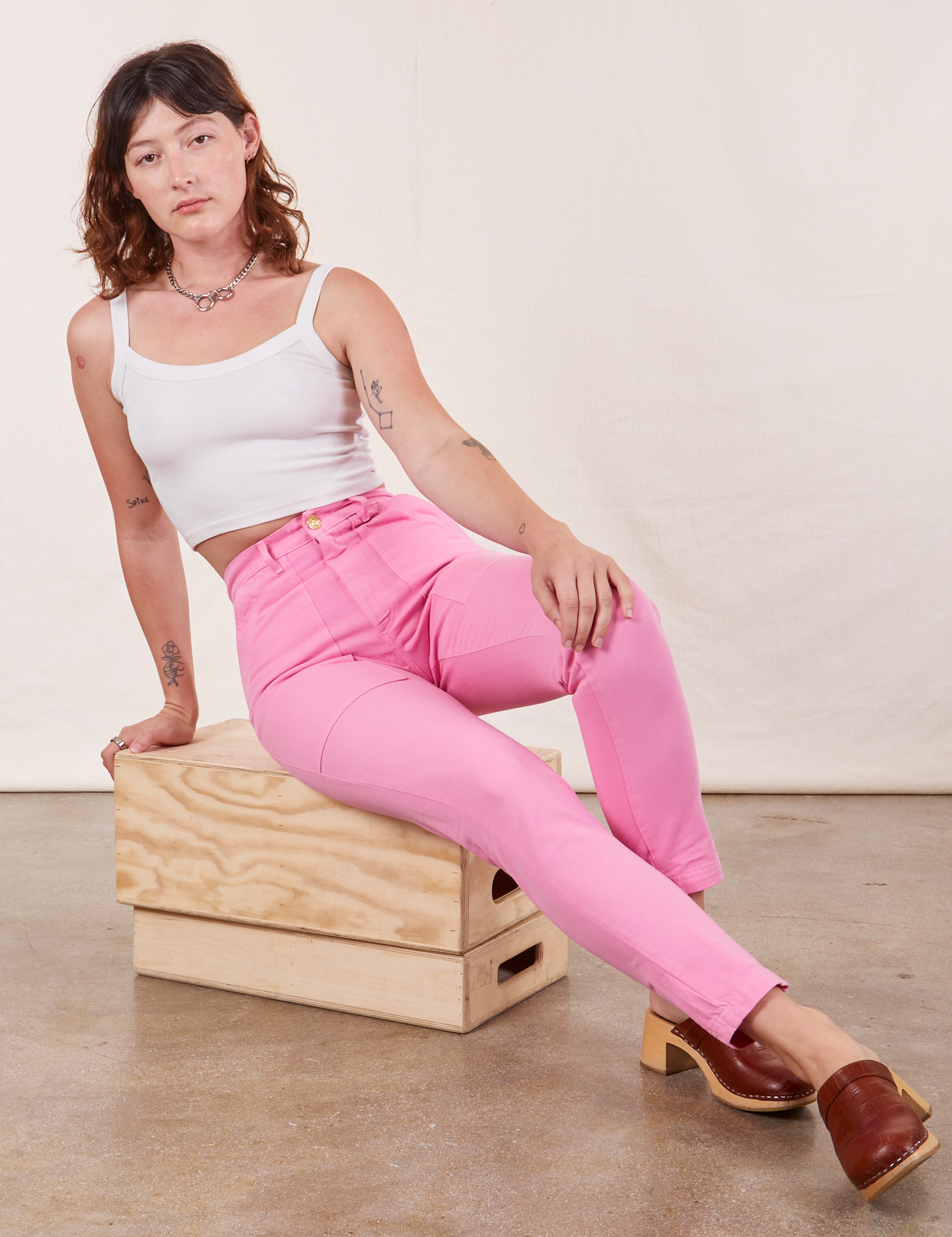 Alex is wearing Pencil Pants in Bubblegum Pink and vintage off-white Cropped Cami