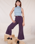 Alex is wearing Sleeveless Essential Turtleneck in Periwinkle and nebula purple Bell Bottoms