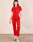 Alex is wearing Short Sleeve Jumpsuit in Mustang Red