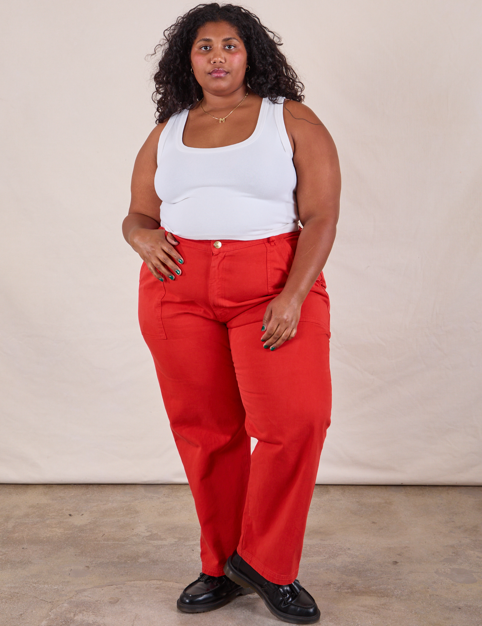 Morgan is wearing Work Pants in Mustang Red and Cropped Tank in Vintage Tee Off-White