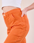 Work Pants in Construction Orange close up side view on Alex