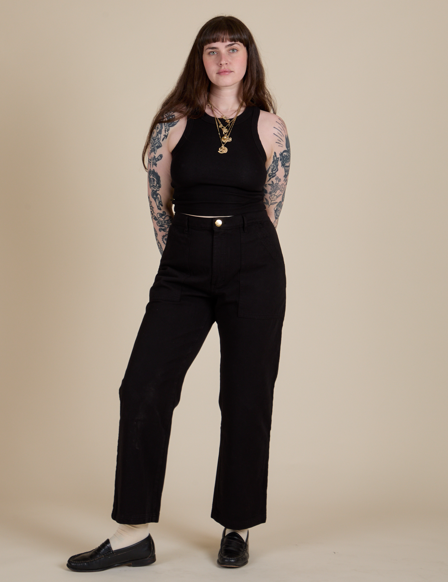 Sydney is wearing Racerback Tank in Black and Work Pants in Black
