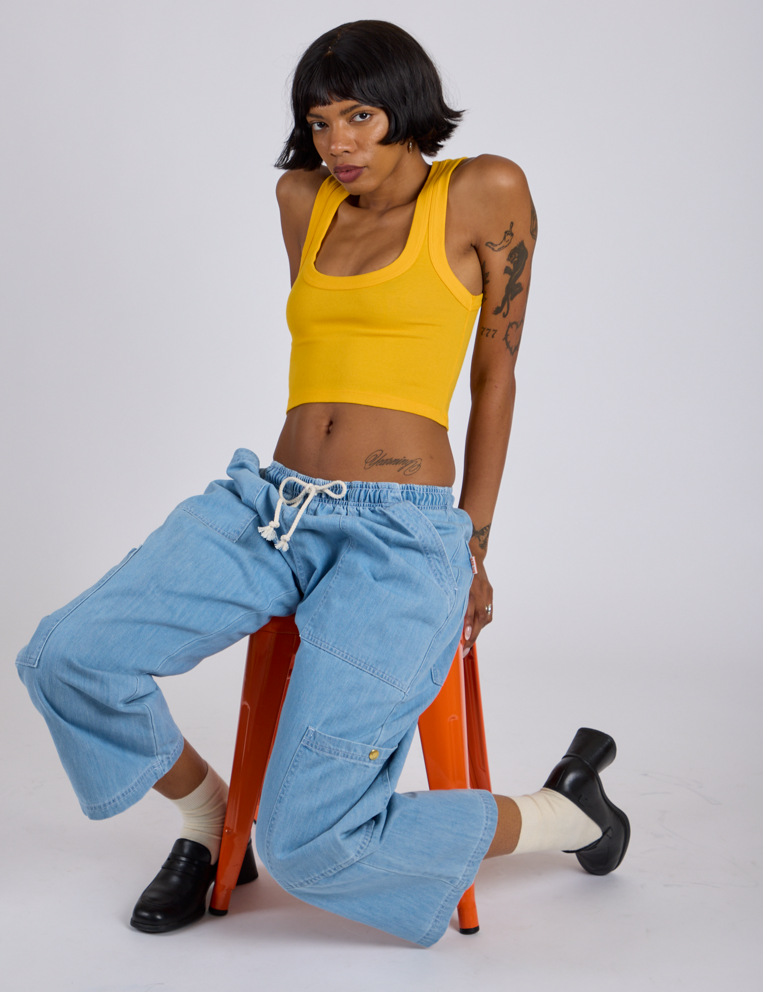 Cropped Tank Top in Sunshine Yellow and light wash Denim Drop Pocket Pants on Kira