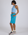 Side view of Longline Work Shorts in Hawaiian Blue and baby blue Racerback Tank