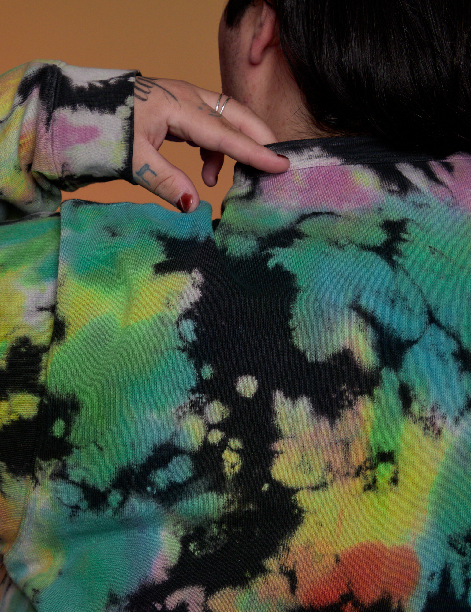 Magic Waters Long Sleeve Burly Tee in Rainbow back shoulder close up on Sam