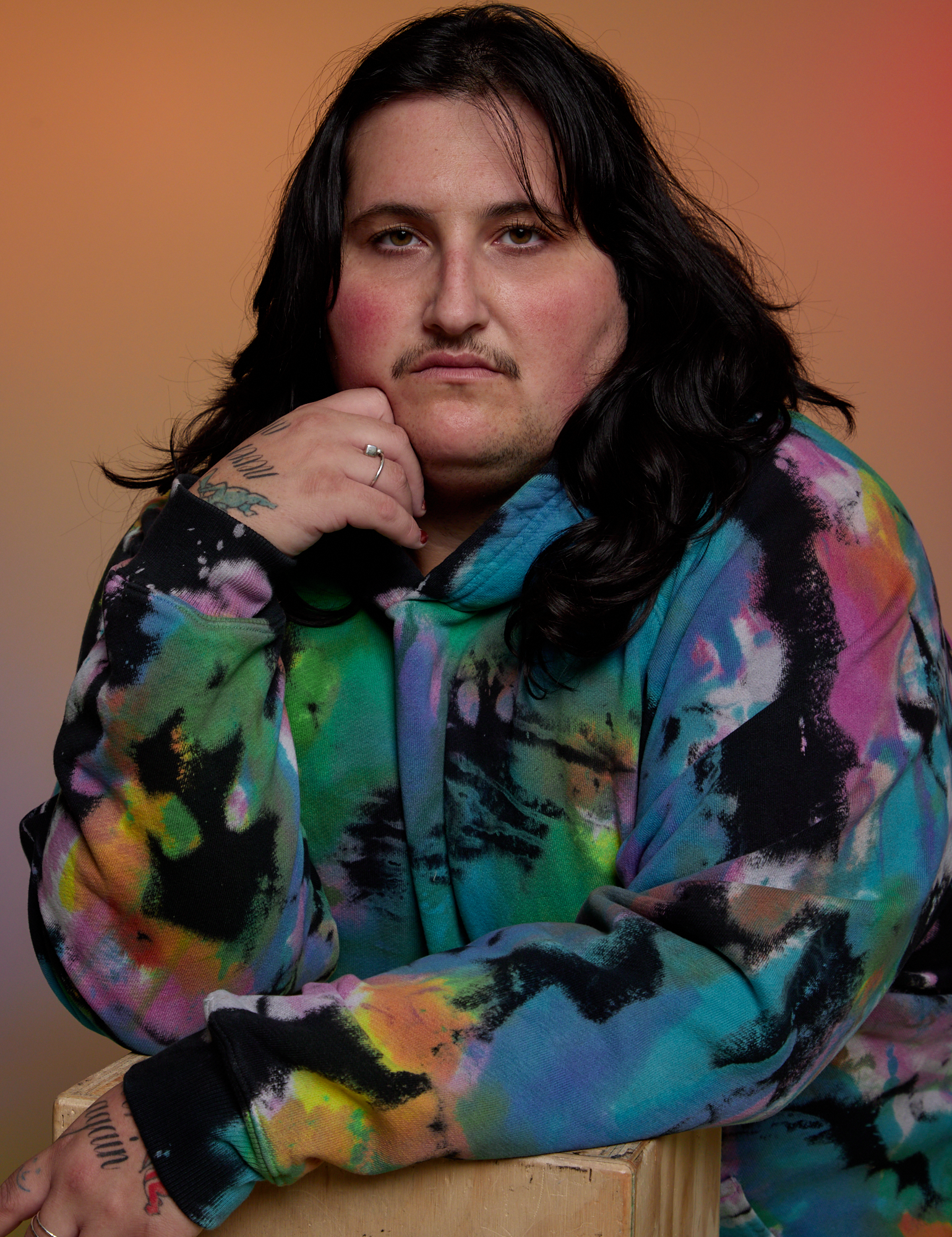 Oversized Hoodie in Rainbow Magic Waters close up on Sam