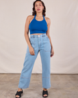 Tiara is wearing Halter Top in Royal Blue and light wash Carpenter Jeans