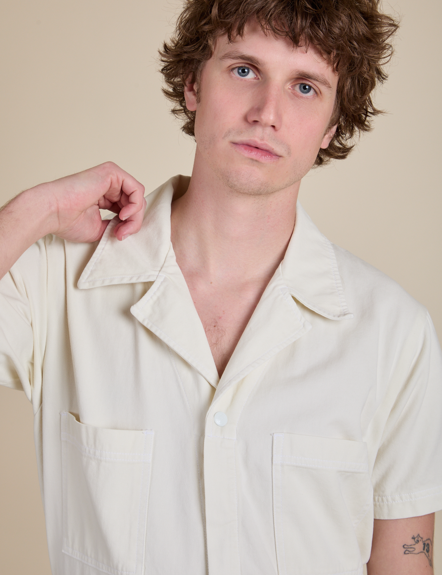 Short Sleeve Jumpsuit in Vintage Tee White front close up on Quinn