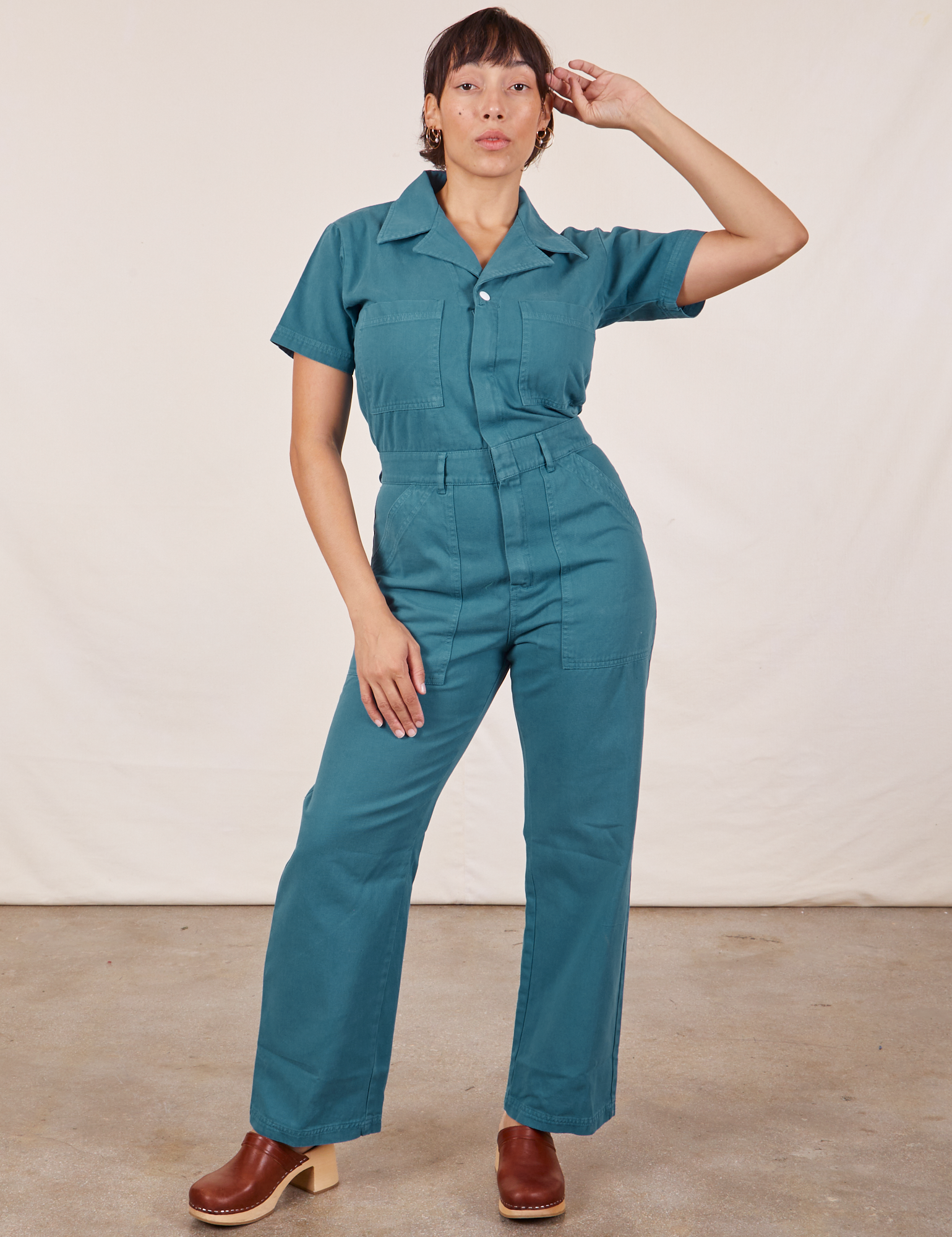 Tiara is 5&#39;4&quot; and wearing S Short Sleeve Jumpsuit in Marine Blue
