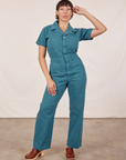 Tiara is 5'4" and wearing S Short Sleeve Jumpsuit in Marine Blue