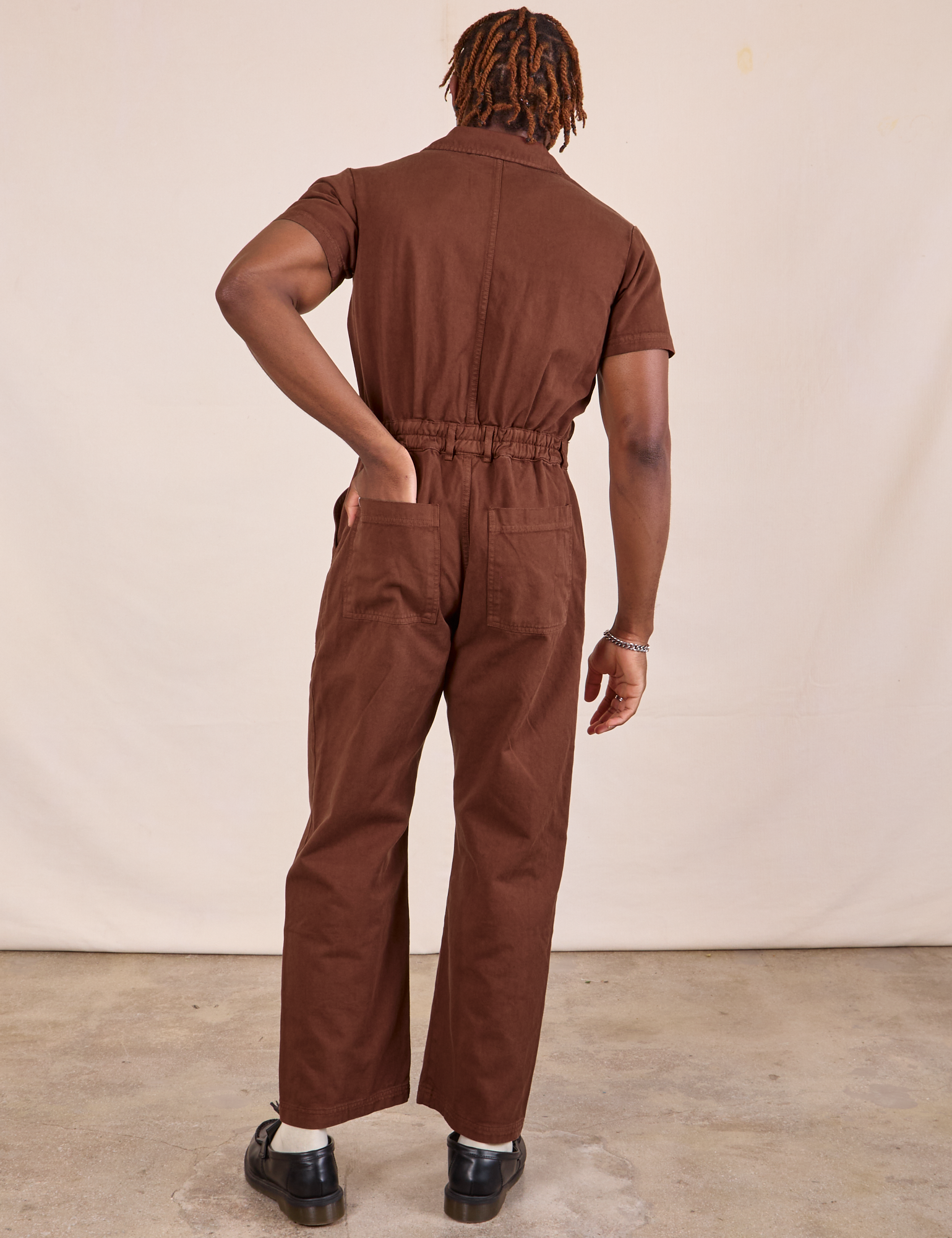 Short Sleeve Jumpsuit in Fudgesicle Brown back view on Issac