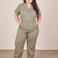 Ashley is 5'7" and wearing 1XL Short Sleeve Jumpsuit in Khaki Grey