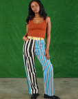 Kandia is 5'3" and wearing S Mismatched Stripe Work Pants paired with a burnt terracotta Cropped Tank Top