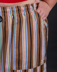Close up of Juliet's hand in the front pocket of Striped Drop Pocket Pants in Retro Rainbow