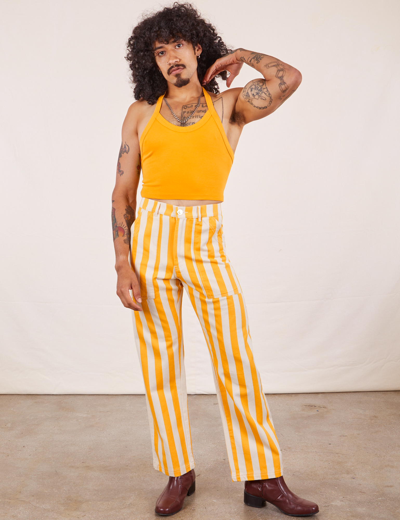 Jesse is 5&#39;8&quot; and wearing XS Work Pants in Lemon Stripe paired with mustard yellow Halter Top
