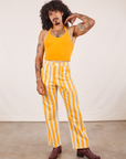 Jesse is 5'8" and wearing XS Work Pants in Lemon Stripe paired with mustard yellow Halter Top
