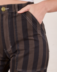 Black Striped Work Pants in Espresso front pocket close up. Alex has her hand in the pocket.