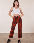 Alex is 5'8" and wearing XS Black Striped Work Pants in Paprika paired with vintage off-white Halter Top