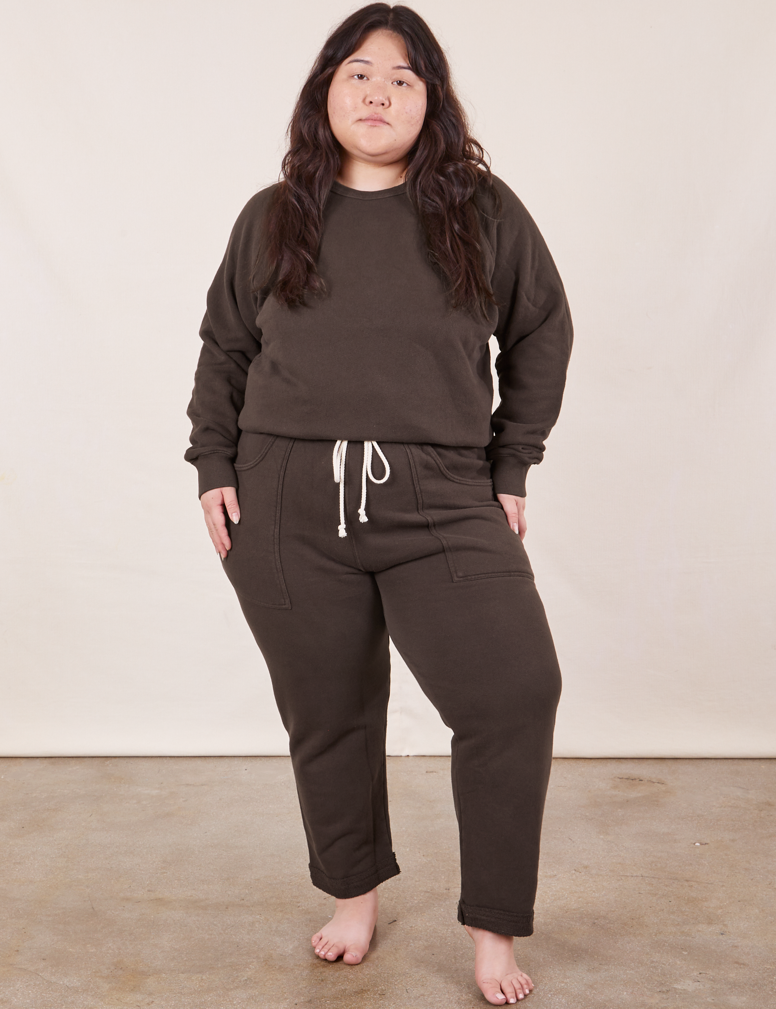 Ashley is wearing Cropped Rolled Cuff Sweatpants in Espresso Brown and matching Heavyweight Crew Sweatshirt