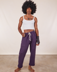 Jerrod is 6'3" and wearing M Cropped Rolled Cuff Sweatpants in Nebula Purple paired with vintage off-white Cami