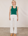 Madeline is wearing Tank Top in Hunter Green and vintage tee off-white Western Pants