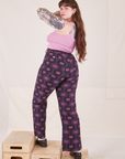 Angled back view of Western Pants in Purple Tile Jacquard and bubblegum pink Cami on Sydney