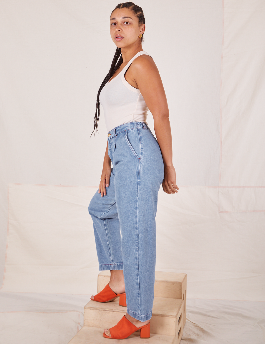 Side view of Denim Trouser Jeans in Light Wash and vintage off-white Tank Top worn by Gabi