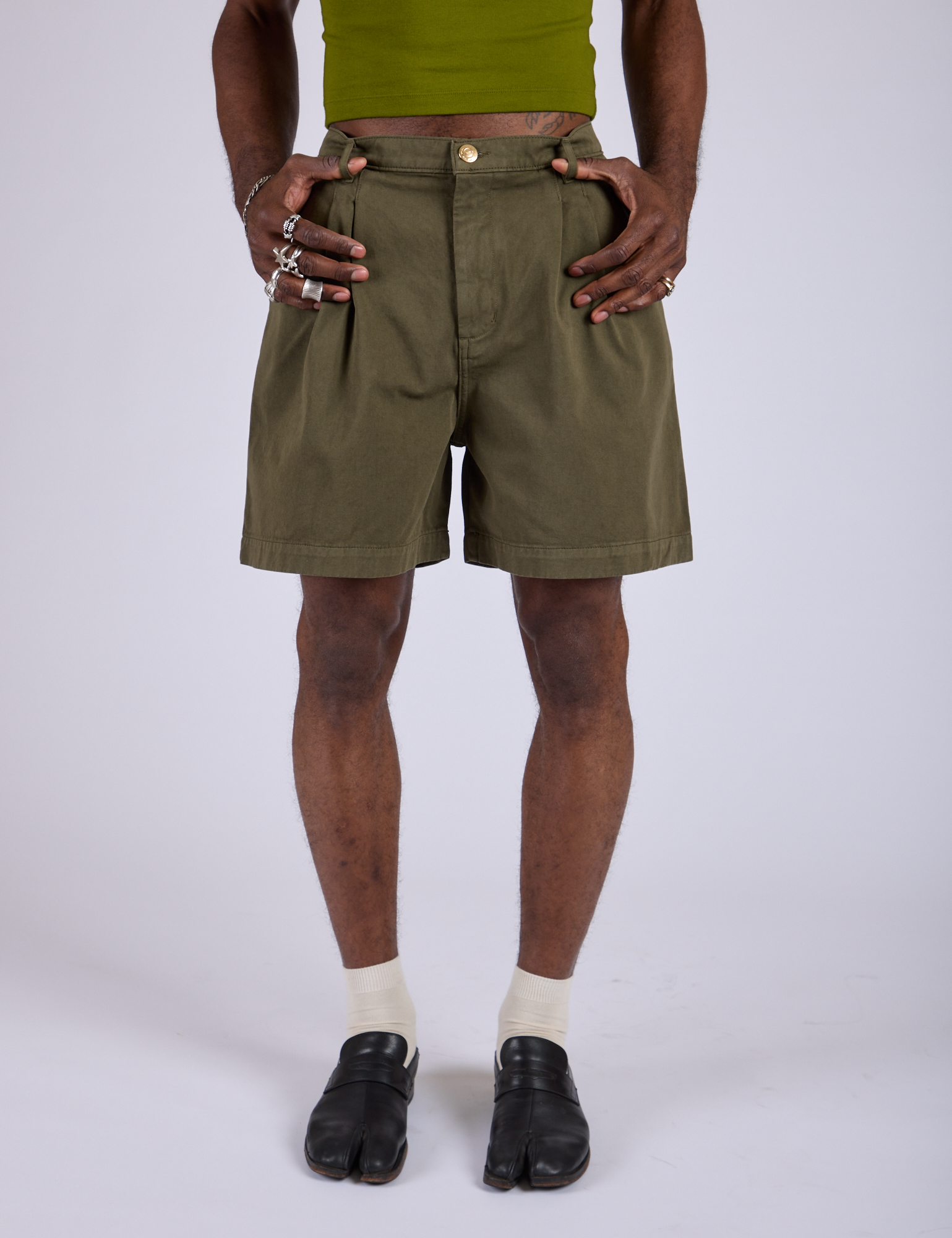 Front close up of Pleated Trouser Shorts in Surplus Green on Jerrod