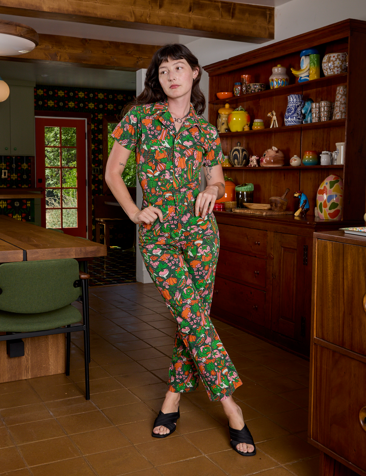 Alex is wearing Short Sleeve Jumpsuit in Kitchen Collection