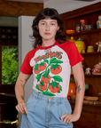 Alex is 5'8" and wearing P Short Sleeve Raglan Tee in Tomatoes