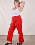 Side view of Western Pants in Mustang Red and Cropped Cami in Vintage Tee Off-White on Lish