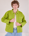 Quinn is 6'4" and wearing L Denim Work Jacket in Gross Green