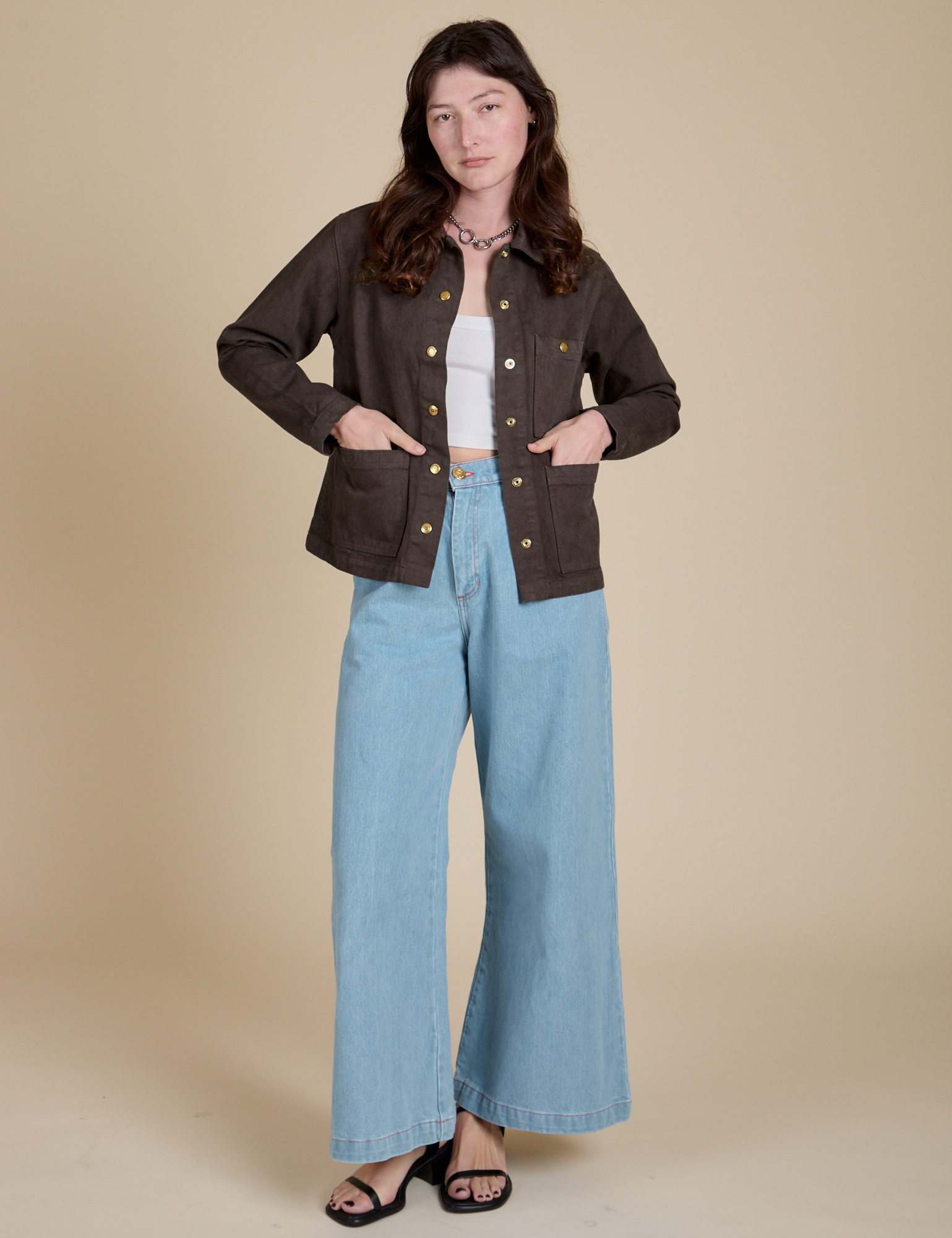 Alex is wearing Denim Work Jacket in Espresso Brown and light wash Indigo Wide Leg Trousers